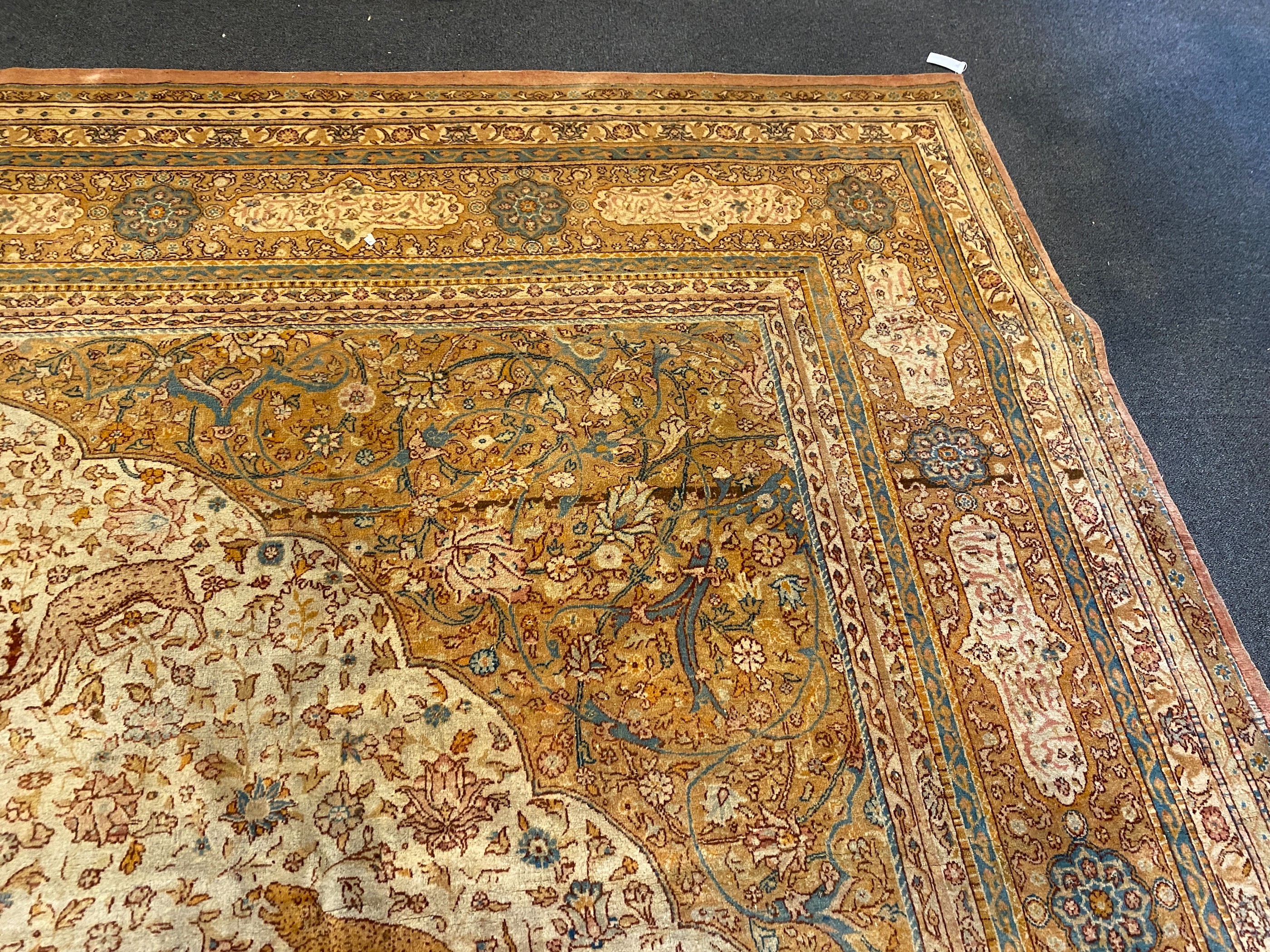 An early 20th century Tabriz ivory ground carpet, 528 x 348cm